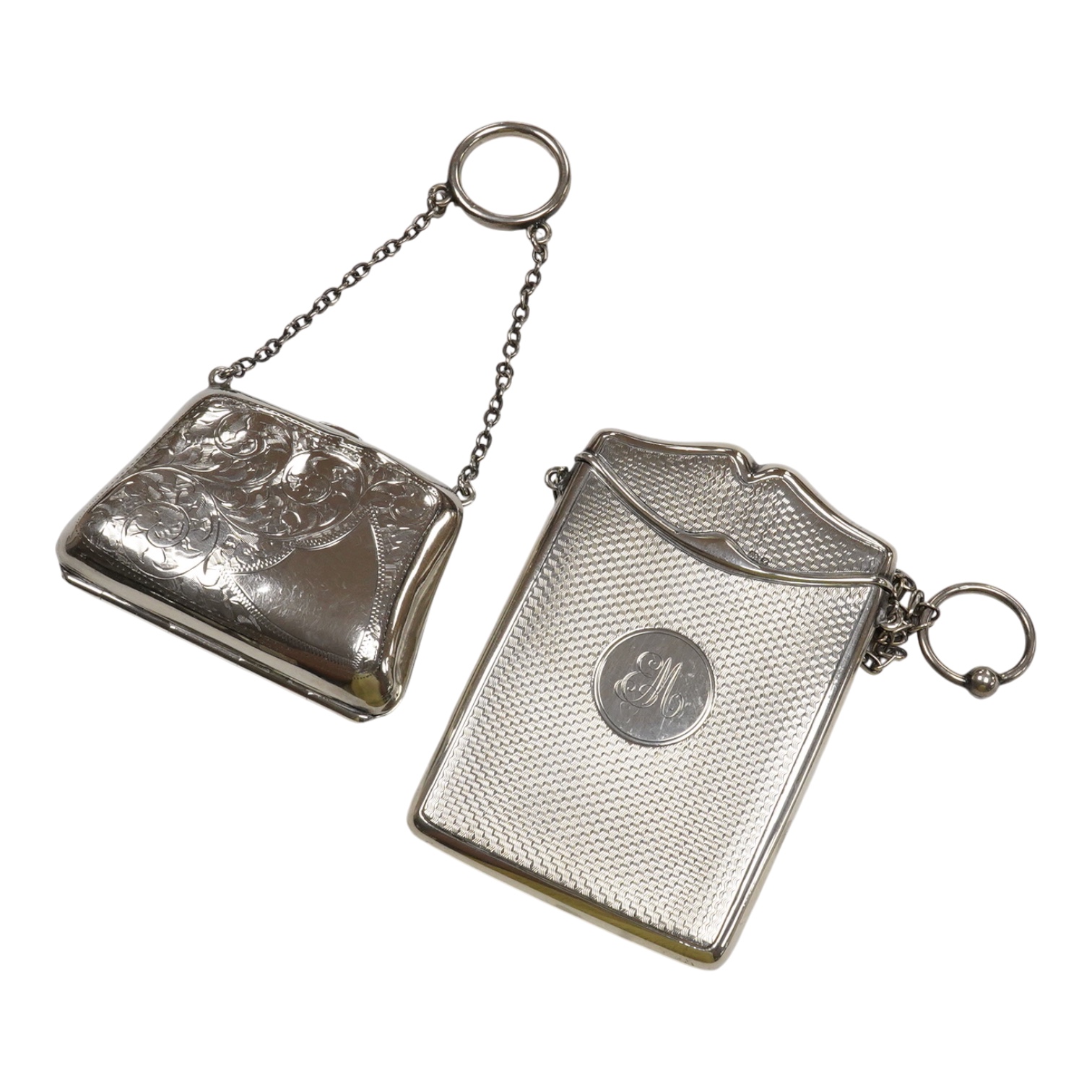 A George V engine turned silver card case, with suspension chain, Synyer & Beddoes, Chester, 1911, 97mm, together with a silver mounted purse, with suspension chain.